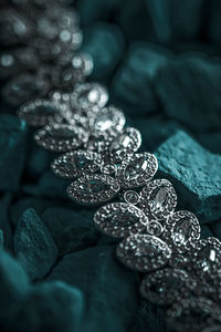 Full frame shot of jewelry on stones outdoors