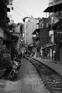 Railroad tracks amidst houses