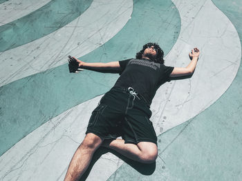 High angle view of young man in swimming pool