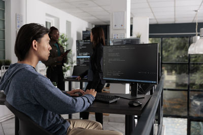 Side view of man working at home