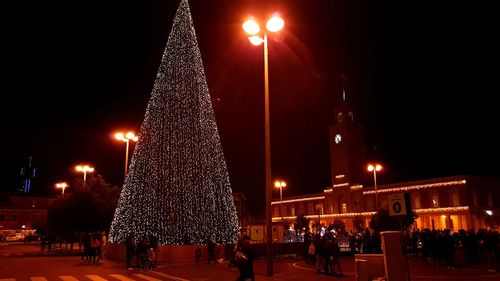 Illuminated christmas tree at night