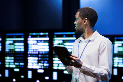 Young man using digital tablet