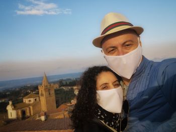 Selfie of couple with masks