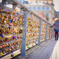 Love padlocks on footbridge railing