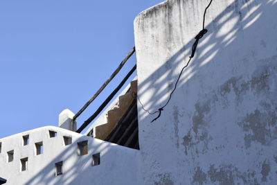 Low angle view of built structure against blue sky