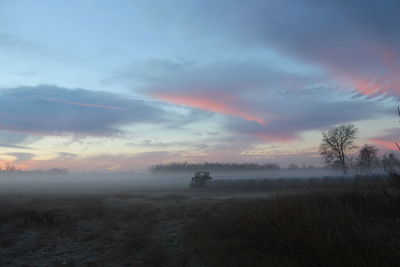 Scenic view of landscape against dramatic sky