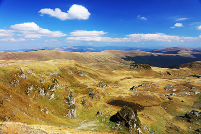 Scenic view of landscape against cloudy sky