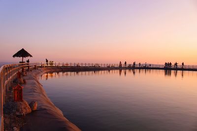 Scenic view of sea against clear sky during sunset