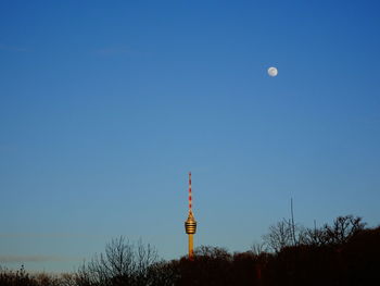 View of communications tower against blue sky