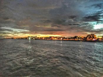 Scenic view of sea against sky at sunset