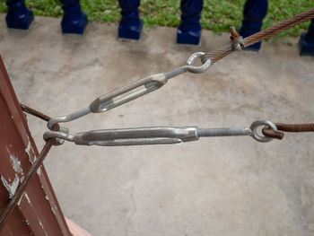 High angle view of chains pulling metal equipment