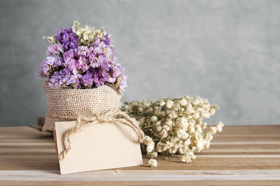 Close-up of purple flower pot on table