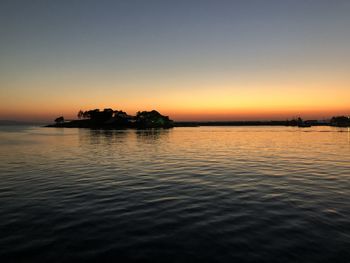 Scenic view of sea against orange sky