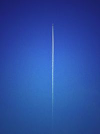 Low angle view of airplane against clear sky