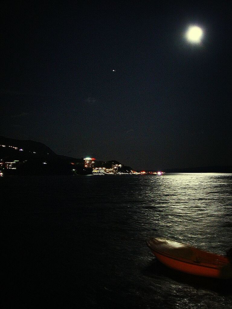 night, illuminated, water, transportation, sea, copy space, nautical vessel, clear sky, mode of transport, boat, waterfront, tranquility, scenics, tranquil scene, beauty in nature, sky, nature, moon, outdoors, river