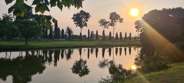 Scenic view of lake against sky during sunset