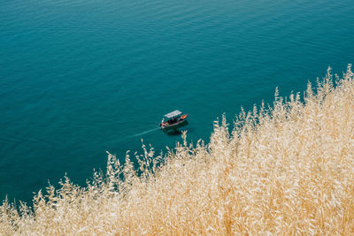 High angle view of nautical vessel on sea shore