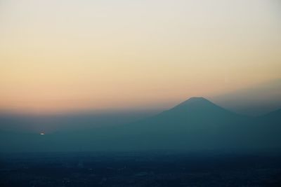 Scenic view of mountains against sky during sunset