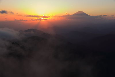 Scenic view of mountains against sky during sunset