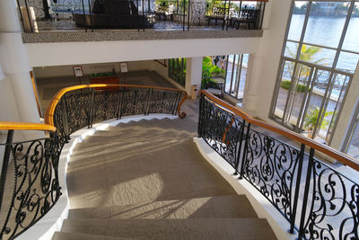 High angle view of chairs at balcony