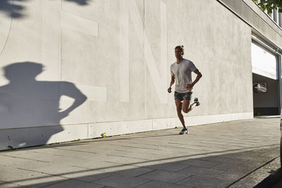 Young man running in the city