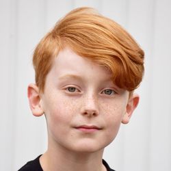 Close-up portrait of boy with redhead