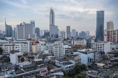 Modern buildings in city against sky