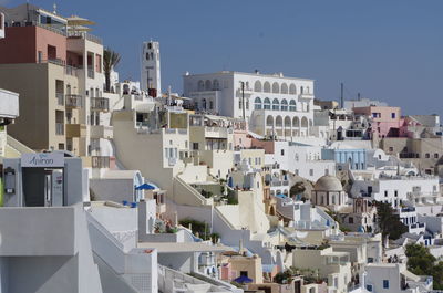 Town against clear blue sky