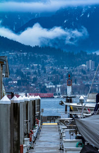 Boats moored at harbor