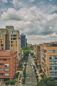 High angle view of buildings in city against sky