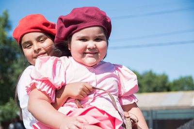 Portrait of smiling little sisters 