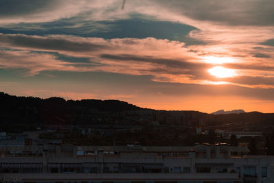 High angle view of townscape against sky during sunset