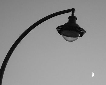 Low angle view of light bulb against sky
