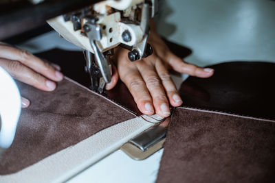 Cropped hand of man working in workshop