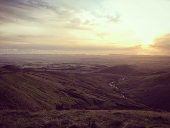 Scenic view of landscape against sky during sunset