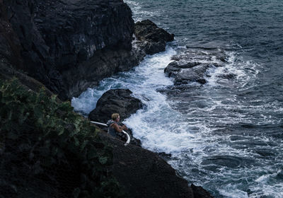 High angle view of man surfing in sea