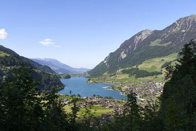 Scenic view of lake and mountains against sky