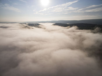 Over the fog in the mountains at sunrise