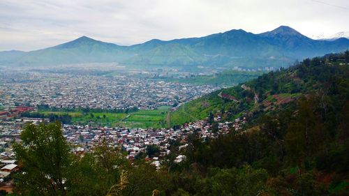 High angle view of trees and mountains against sky