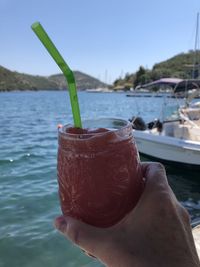 Close-up of hand holding drink