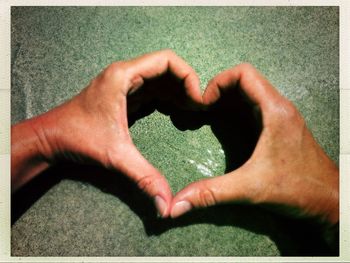 Close-up of man holding heart shape