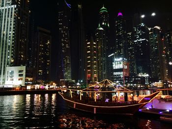 Illuminated buildings in city at night