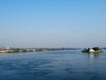 Scenic view of sea against clear blue sky