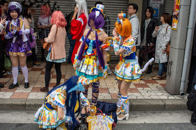 Group of people at street market in city