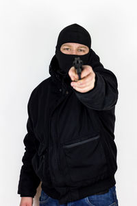 Man wearing mask against white background