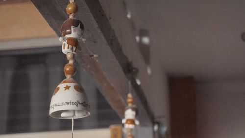 Low angle view of lighting equipment hanging on ceiling of building