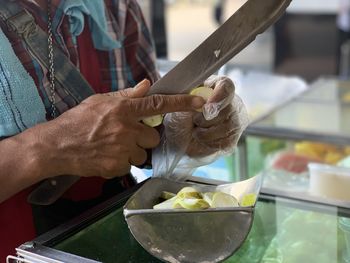 Midsection of man preparing food