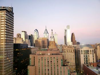 Modern buildings in city against clear sky