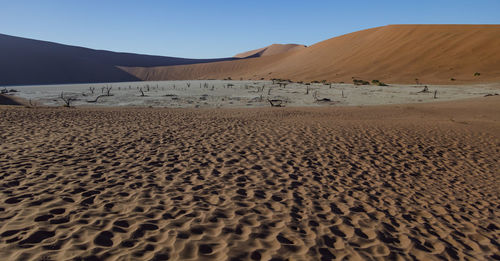 Scenic view of desert against clear sky