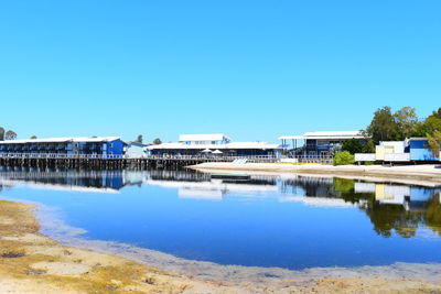 Built structures against clear blue sky